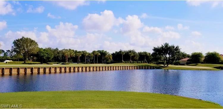 20199 Markward Crossing Estero, FL 33928 - Photo 43 of 45 a view of a swimming pool with a yard and a wooden fence