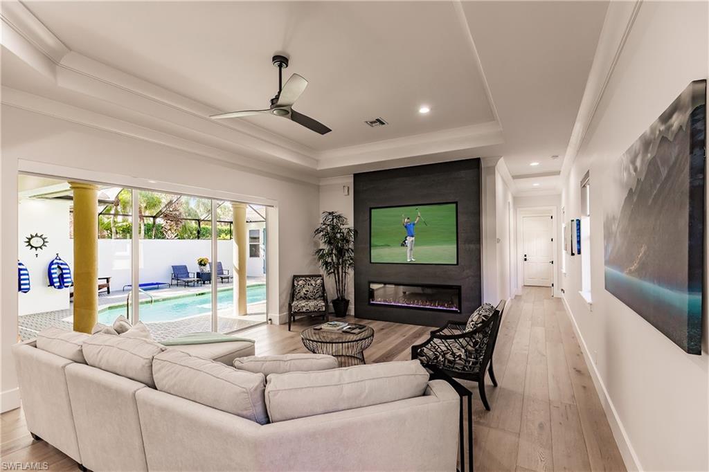 20199 Markward Crossing Estero, FL 33928 - Photo 6 of 45 a living room with furniture and a flat screen tv