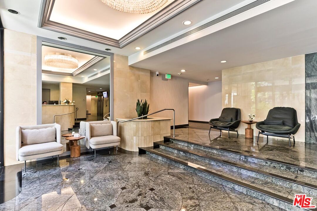 2160 Century Park East, Unit 503 Los Angeles, CA 90067 - Photo 22 of 22 a living room with lots of furniture and a rug