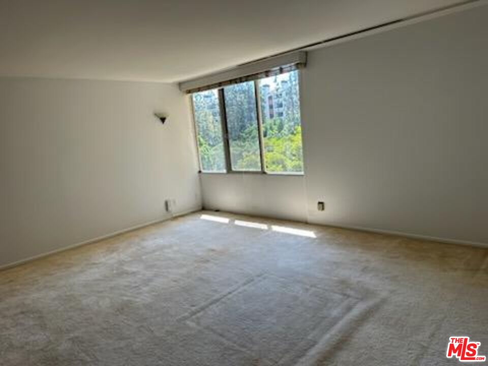 2160 Century Park East, Unit 503 Los Angeles, CA 90067 - Photo 6 of 22 an empty room with windows
