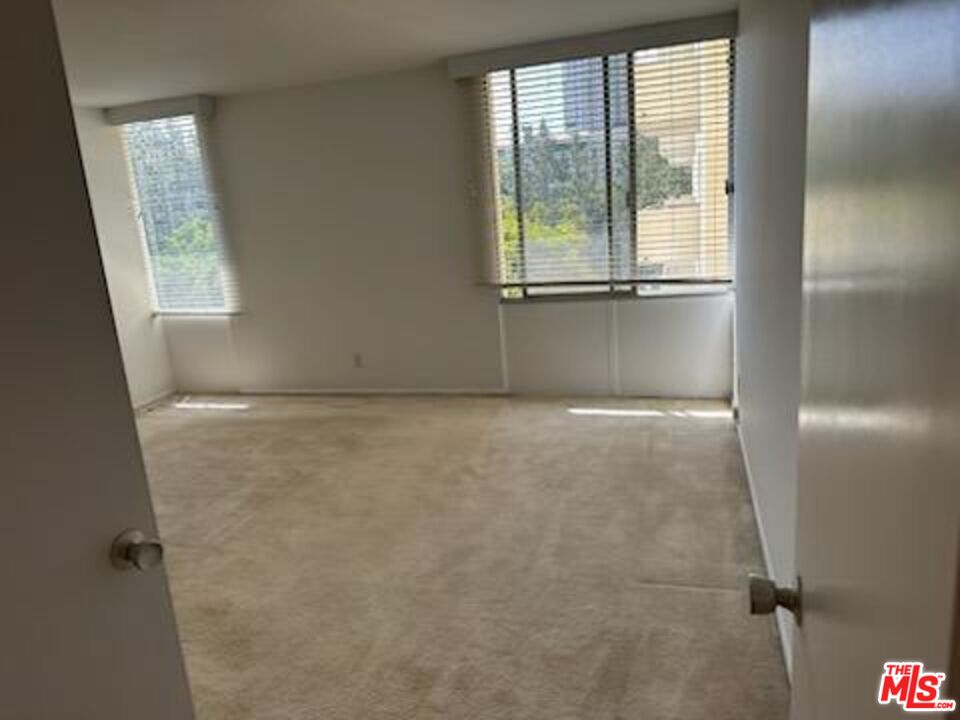 2160 Century Park East, Unit 503 Los Angeles, CA 90067 - Photo 7 of 22 a view of an empty room with a window