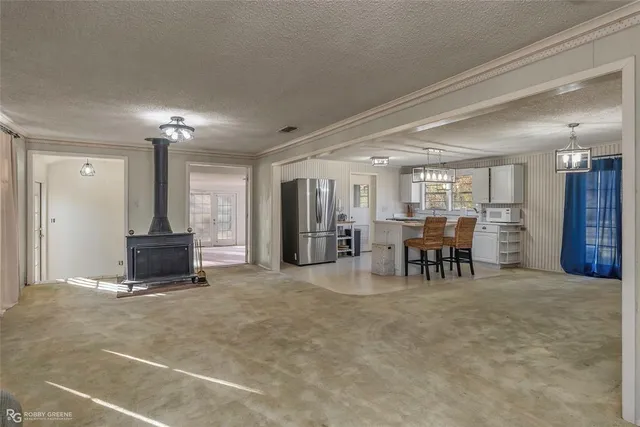 a view of a livingroom with furniture and a chandelier