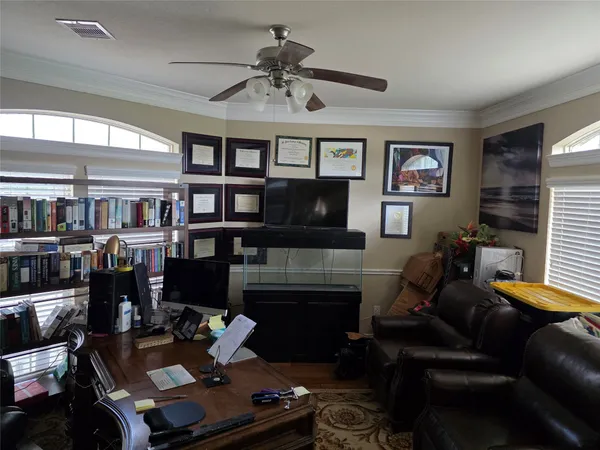 a living room with furniture fireplace and flat screen tv