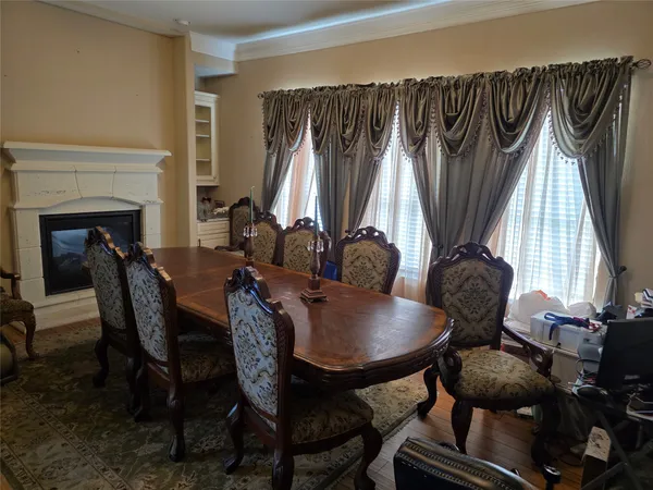 a view of a dining room with furniture and window