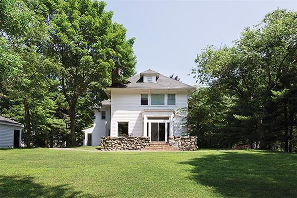 369 Dudley Road Newton, MA 02459 - Photo 8 of 9 a front view of a house with a garden