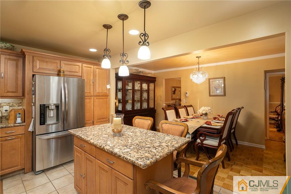 460 Warfield Road North Plainfield, NJ 07060 - Photo 12 of 29 a kitchen with granite countertop kitchen island stainless steel appliances a refrigerator a sink a stove and a refrigerator