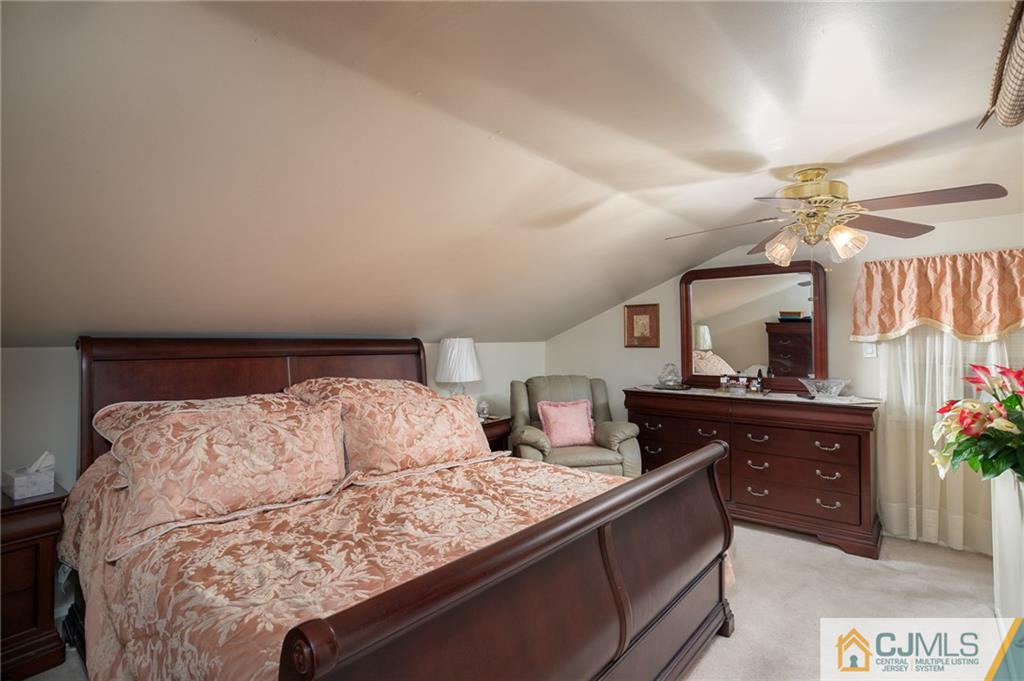 460 Warfield Road North Plainfield, NJ 07060 - Photo 14 of 29 a bedroom with a bed and a dresser