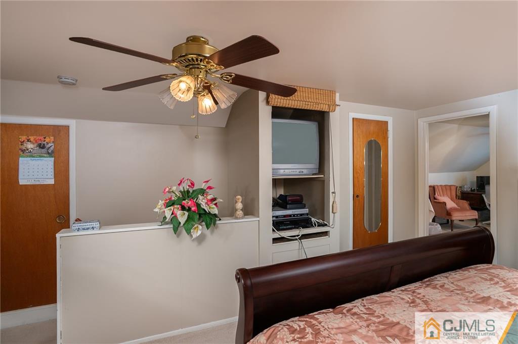 460 Warfield Road North Plainfield, NJ 07060 - Photo 15 of 29 a bedroom with a bed and a chandelier