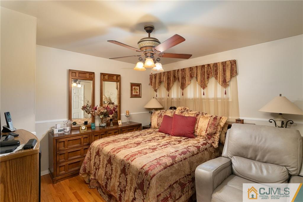 460 Warfield Road North Plainfield, NJ 07060 - Photo 19 of 29 a bedroom with a bed and a chandelier