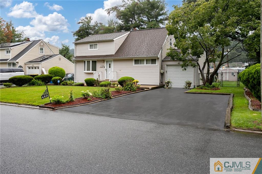 460 Warfield Road North Plainfield, NJ 07060 - Photo 3 of 29 a front view of a house with a yard and garage