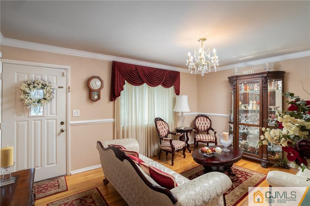 460 Warfield Road North Plainfield, NJ 07060 - Photo 5 of 29 a view of a dining room with furniture a chandelier and wooden floor