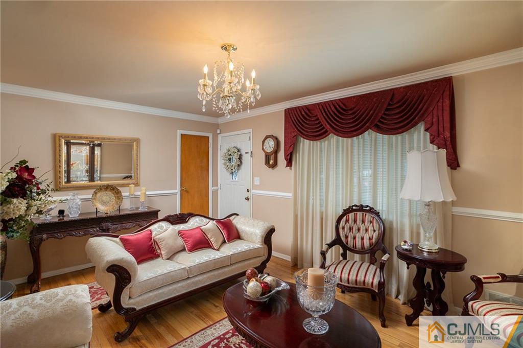 460 Warfield Road North Plainfield, NJ 07060 - Photo 6 of 29 a living room with furniture and a chandelier