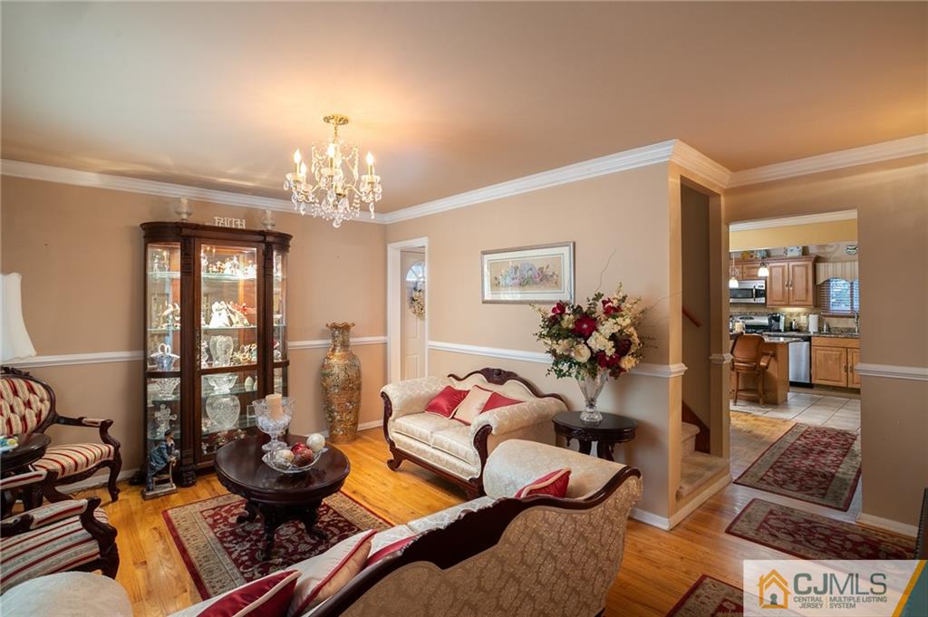 460 Warfield Road North Plainfield, NJ 07060 - Photo 7 of 29 a living room with furniture and a chandelier