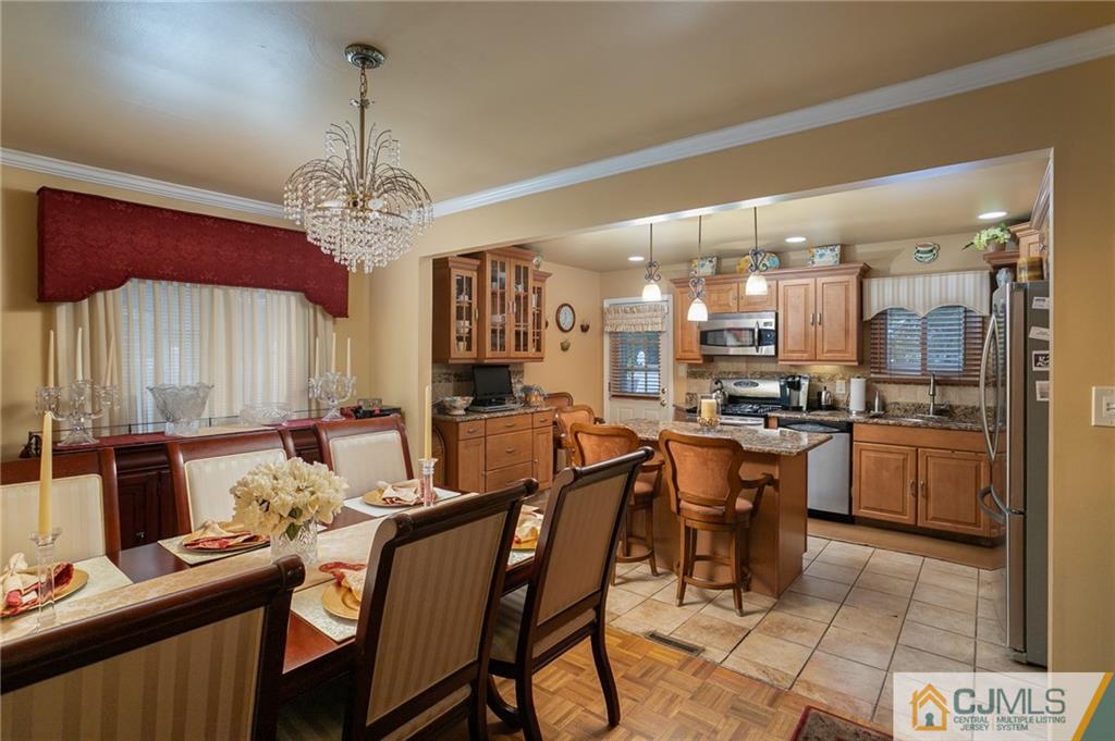 460 Warfield Road North Plainfield, NJ 07060 - Photo 9 of 29 a large kitchen with a table and chairs