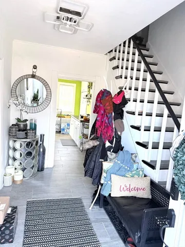 a room with furniture a rug and a window