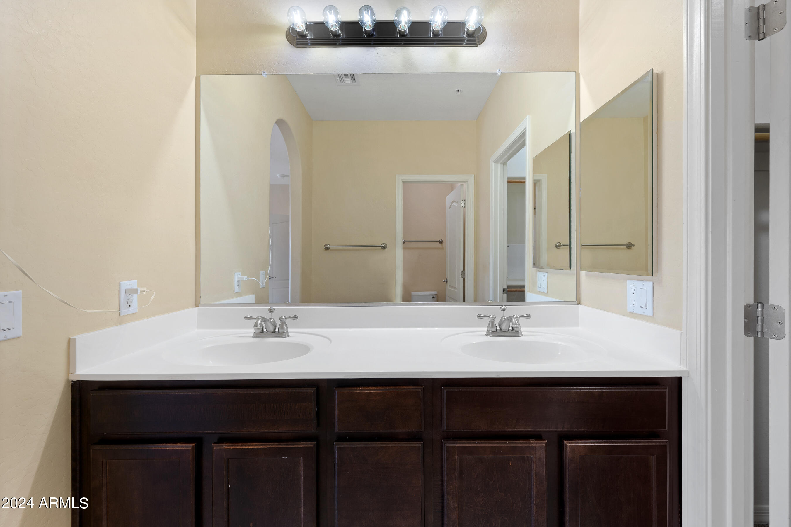 7726 East Baseline Road, Unit 235 Mesa, AZ 85209 - Photo 17 of 31 a sink with a mirror