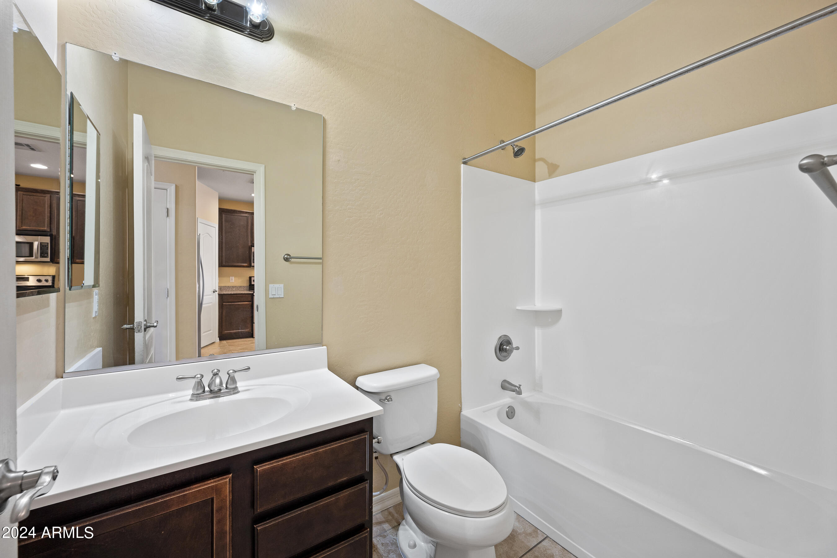 7726 East Baseline Road, Unit 235 Mesa, AZ 85209 - Photo 23 of 31 a bathroom with a sink a toilet and shower
