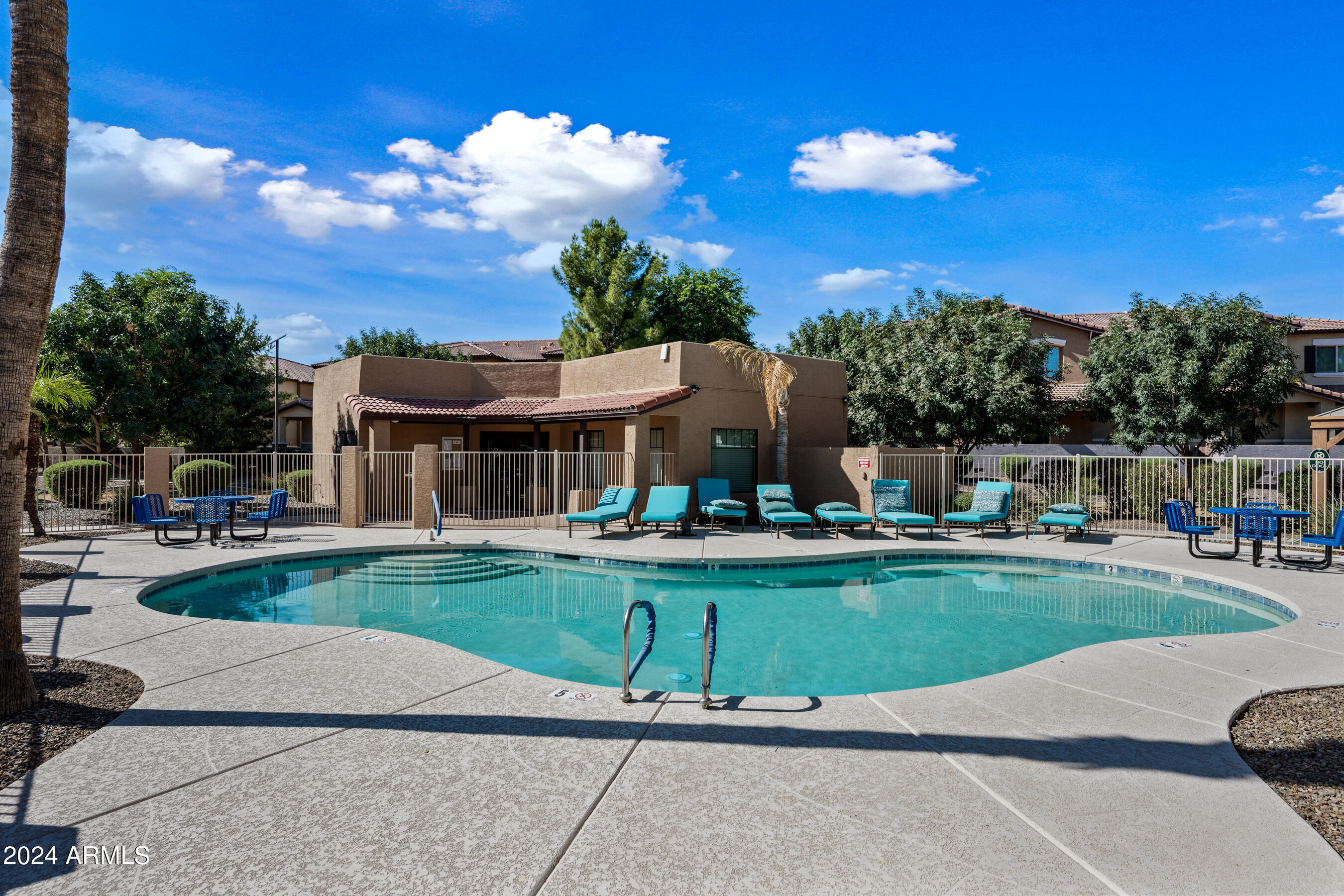 7726 East Baseline Road, Unit 235 Mesa, AZ 85209 - Photo 28 of 31 a front view of a house with a yard table and chairs