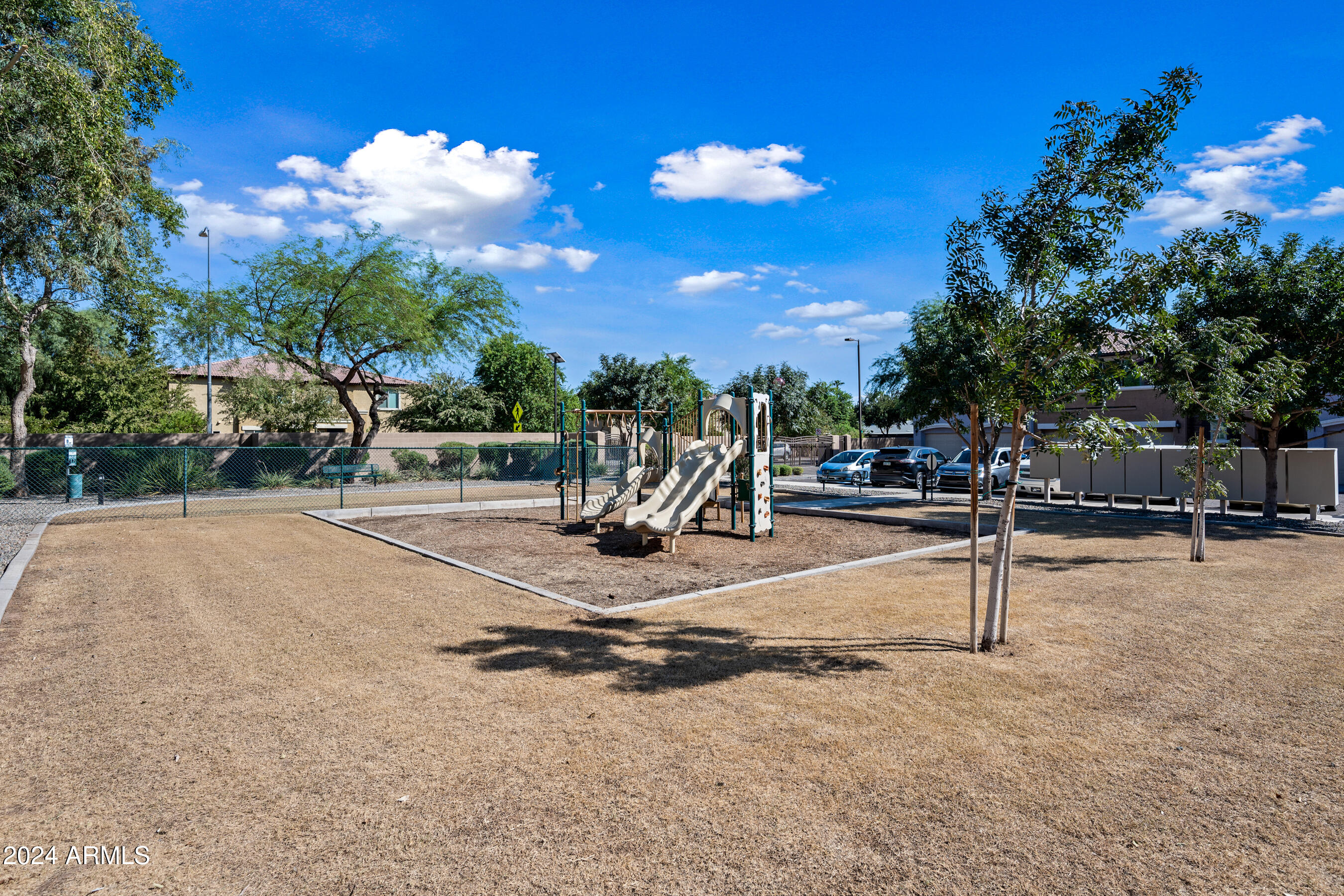 7726 East Baseline Road, Unit 235 Mesa, AZ 85209 - Photo 29 of 31 a view of a street with houses