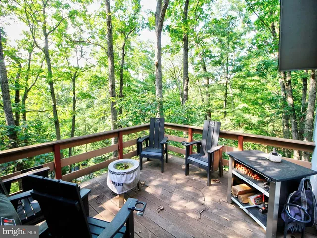 a view of an outdoor sitting area with furniture