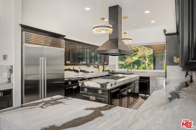 a view of an entryway with a chandelier