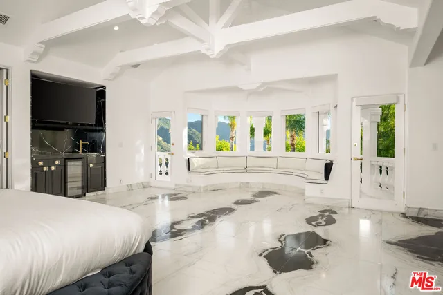 a view of a living room and entry way