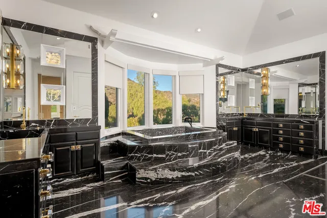 a white bath tub sitting in a bathroom