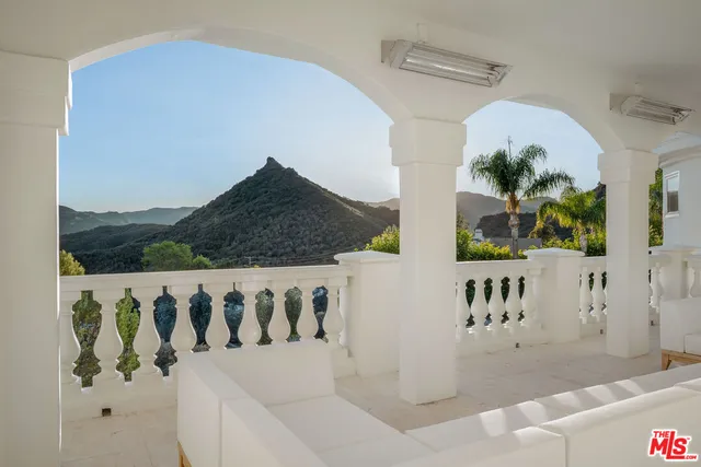 a view of a balcony with an outdoor space