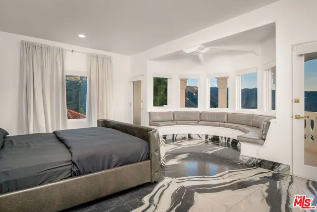 a living room with a couch and a flat screen tv