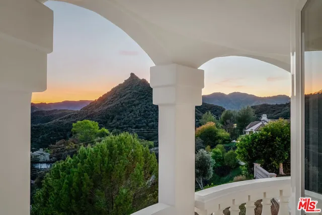 a view of a multi story building with a garden