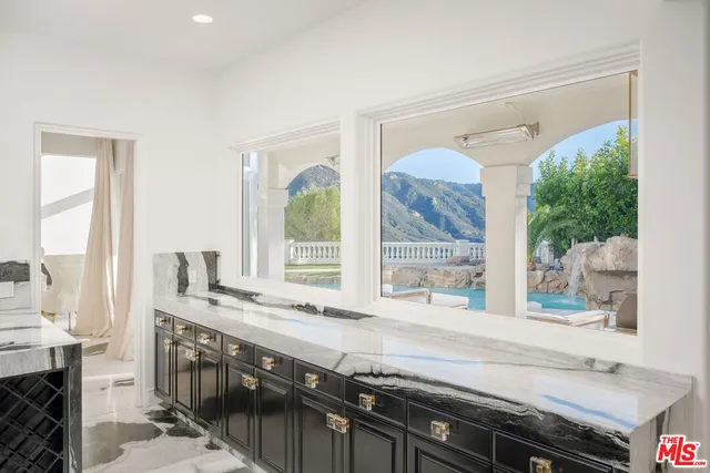a kitchen with a stove and a sink