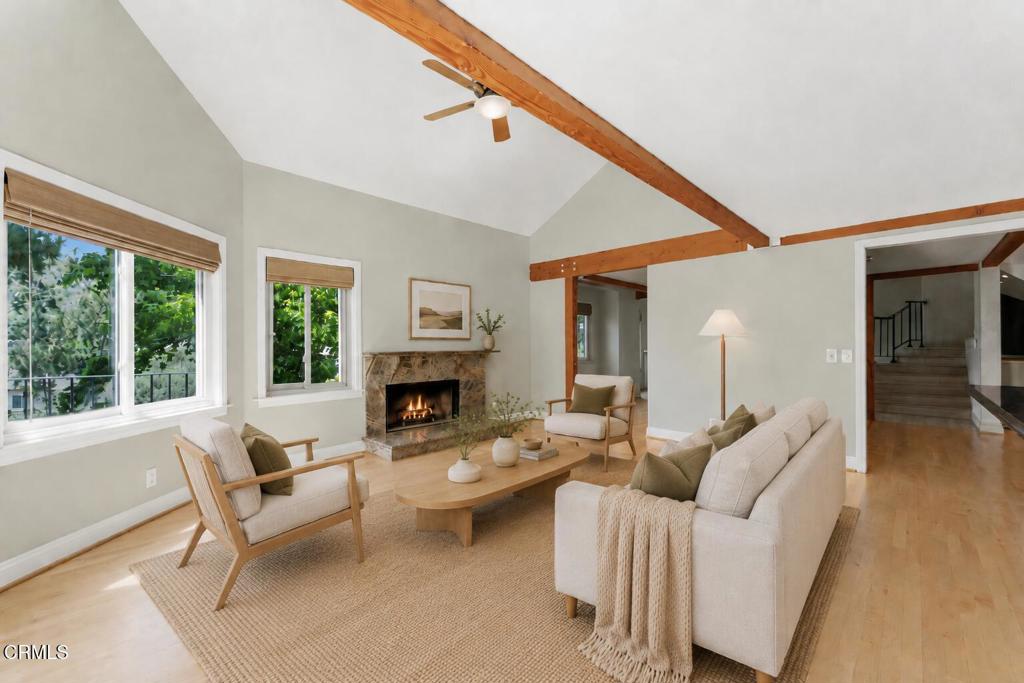 405 Woodcliffe Road Pasadena, CA 91105 - Photo 11 of 65 a living room with furniture and a fireplace