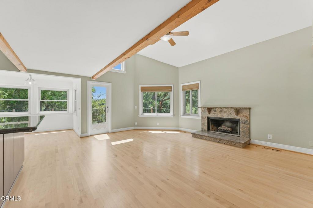 405 Woodcliffe Road Pasadena, CA 91105 - Photo 12 of 65 a view of an empty room with a window and fire place