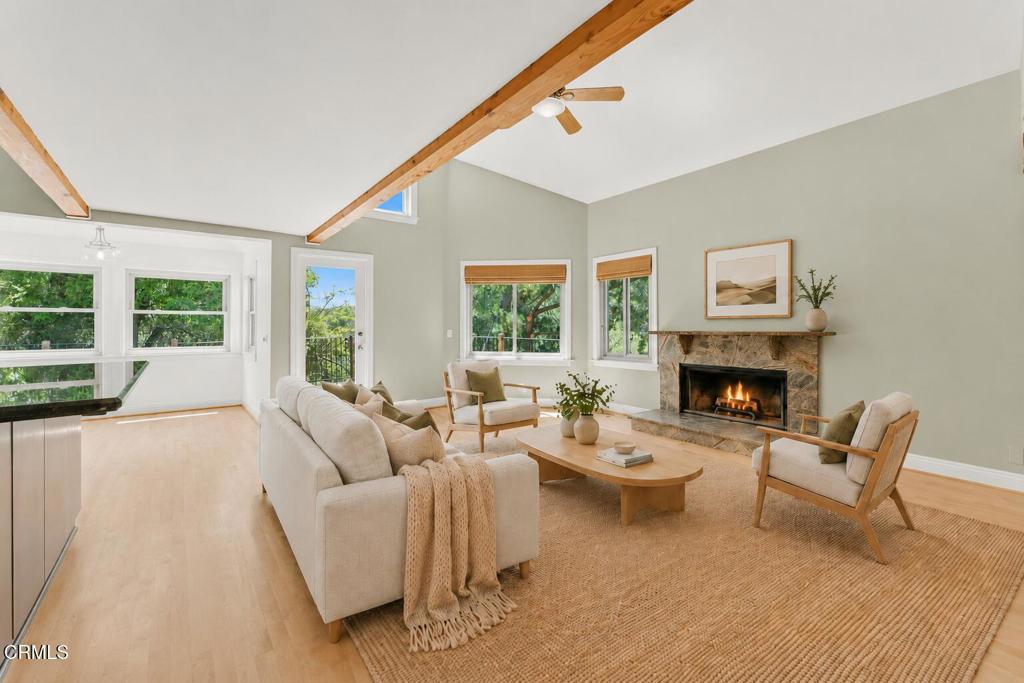 405 Woodcliffe Road Pasadena, CA 91105 - Photo 13 of 65 a living room with furniture and a fireplace