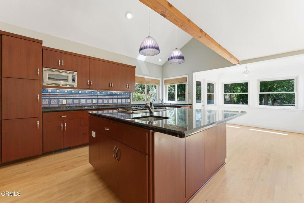 405 Woodcliffe Road Pasadena, CA 91105 - Photo 17 of 65 a kitchen with stainless steel appliances granite countertop a sink and cabinets