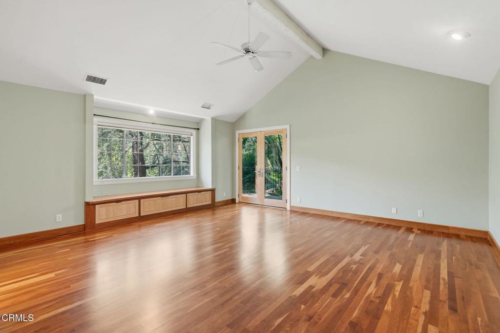 405 Woodcliffe Road Pasadena, CA 91105 - Photo 36 of 65 an empty room with wooden floor and windows