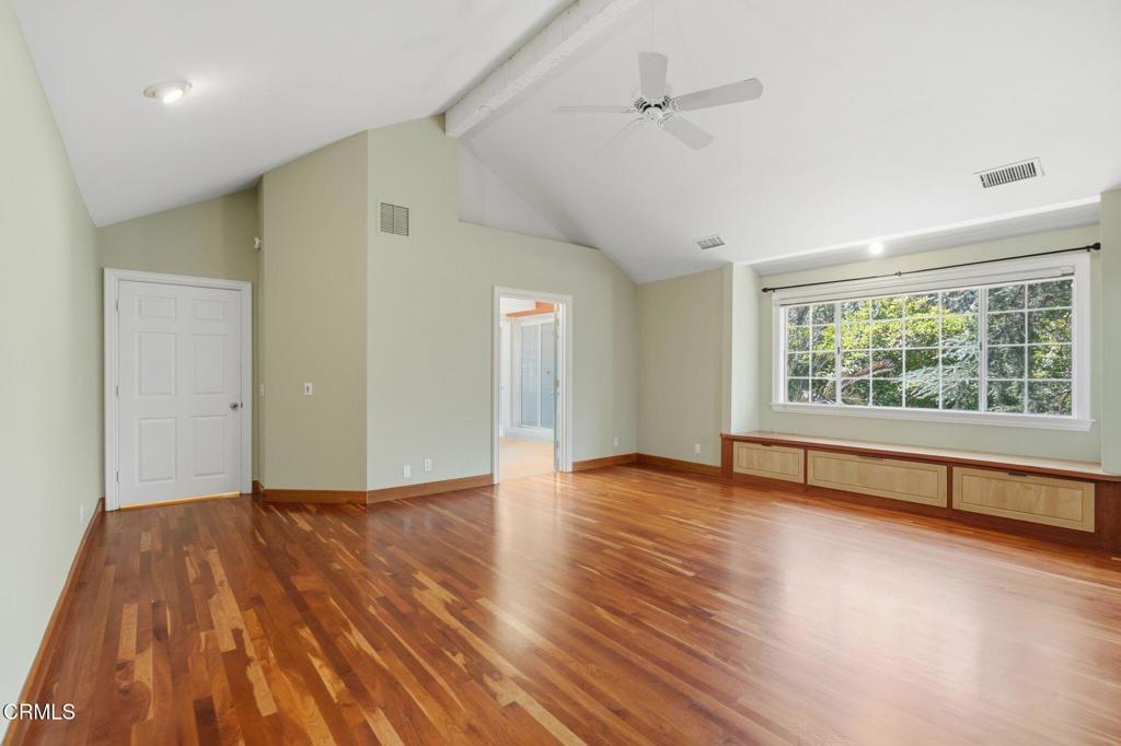 405 Woodcliffe Road Pasadena, CA 91105 - Photo 38 of 65 an empty room with wooden floor and windows