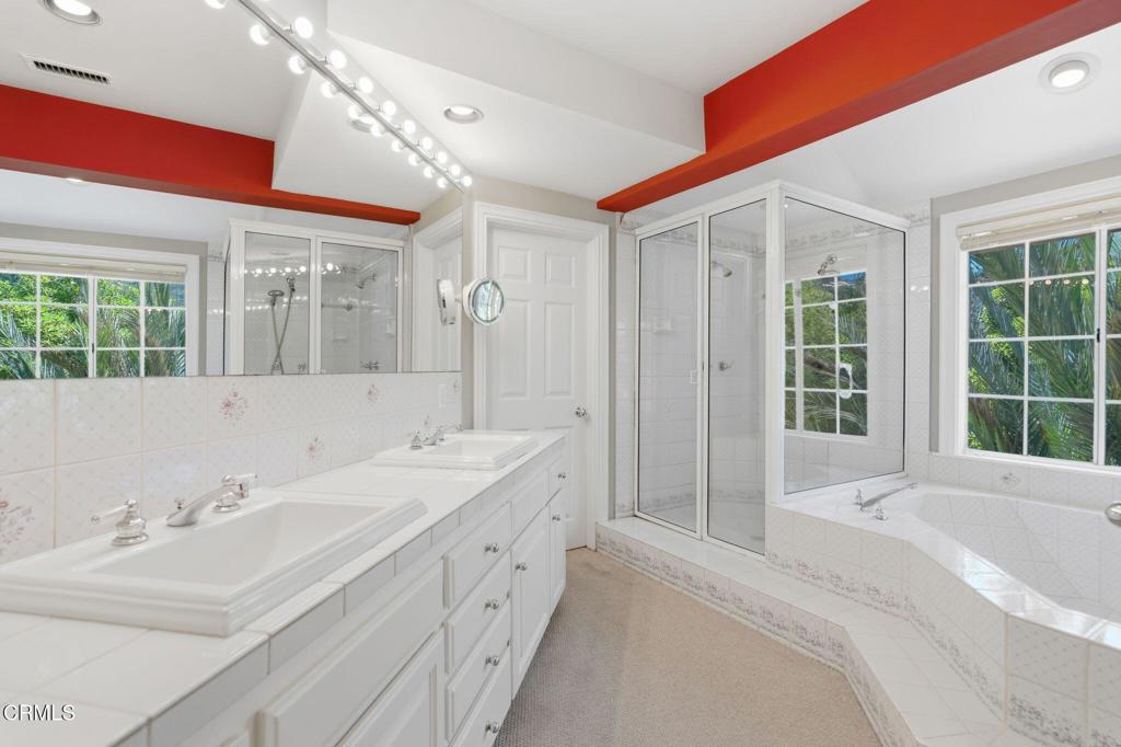 405 Woodcliffe Road Pasadena, CA 91105 - Photo 40 of 65 a spacious bathroom with double vanity and a bathtub