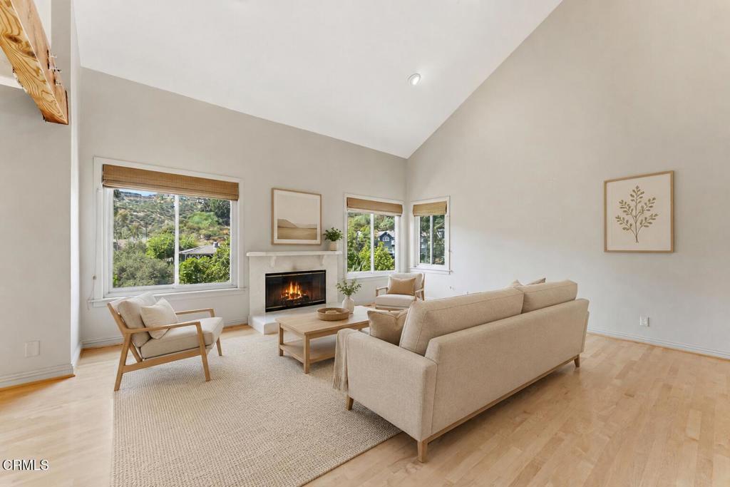 405 Woodcliffe Road Pasadena, CA 91105 - Photo 4 of 65 a living room with furniture and a fireplace