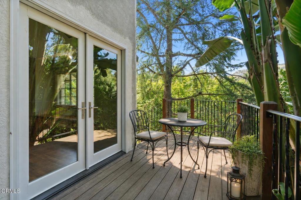 405 Woodcliffe Road Pasadena, CA 91105 - Photo 42 of 65 a view of a porch with furniture and wooden floor