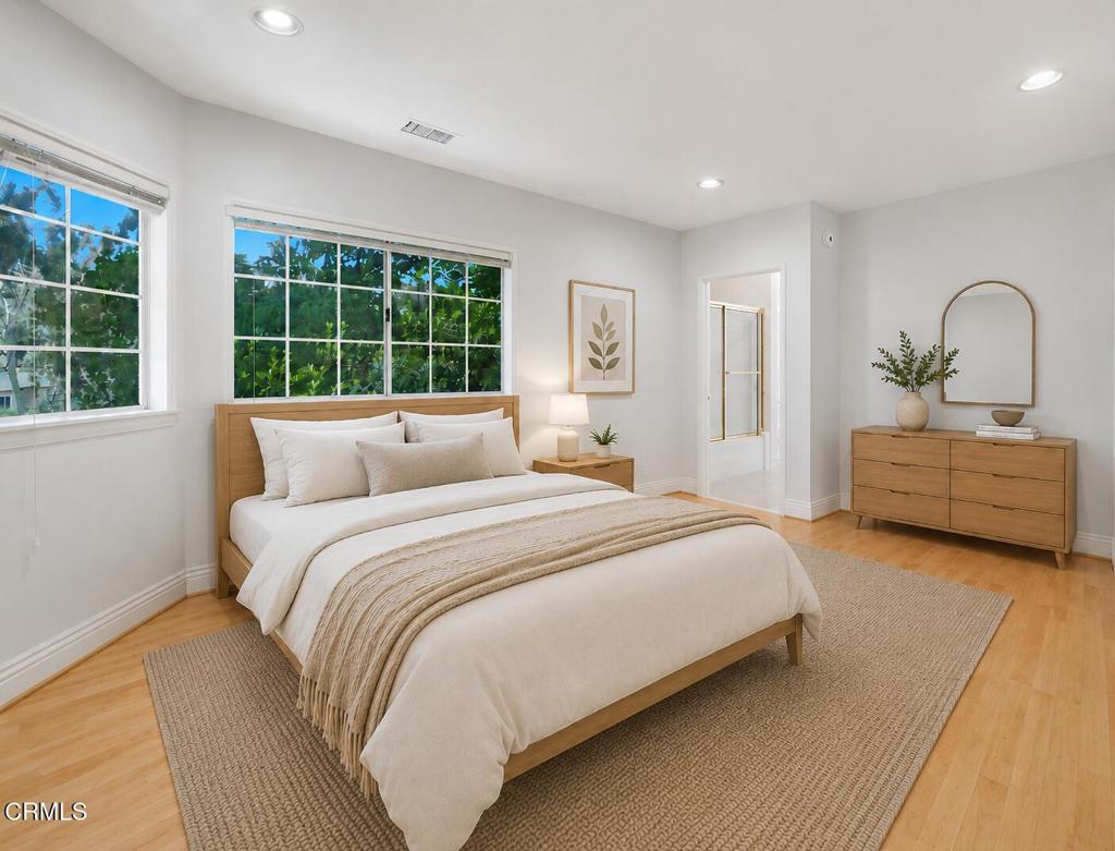 405 Woodcliffe Road Pasadena, CA 91105 - Photo 46 of 65 a spacious bedroom with a bed and a large window