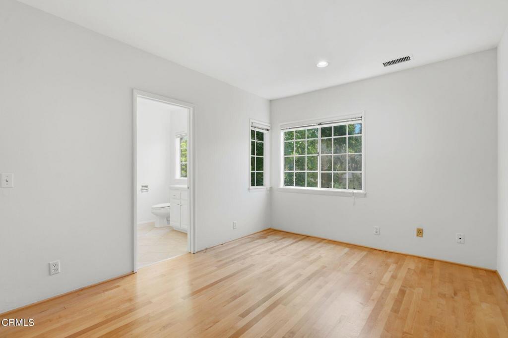 405 Woodcliffe Road Pasadena, CA 91105 - Photo 48 of 65 an empty room with wooden floor and windows