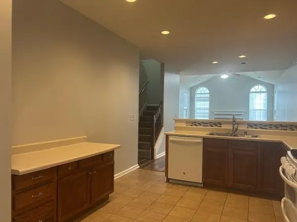 a kitchen with a sink and cabinets