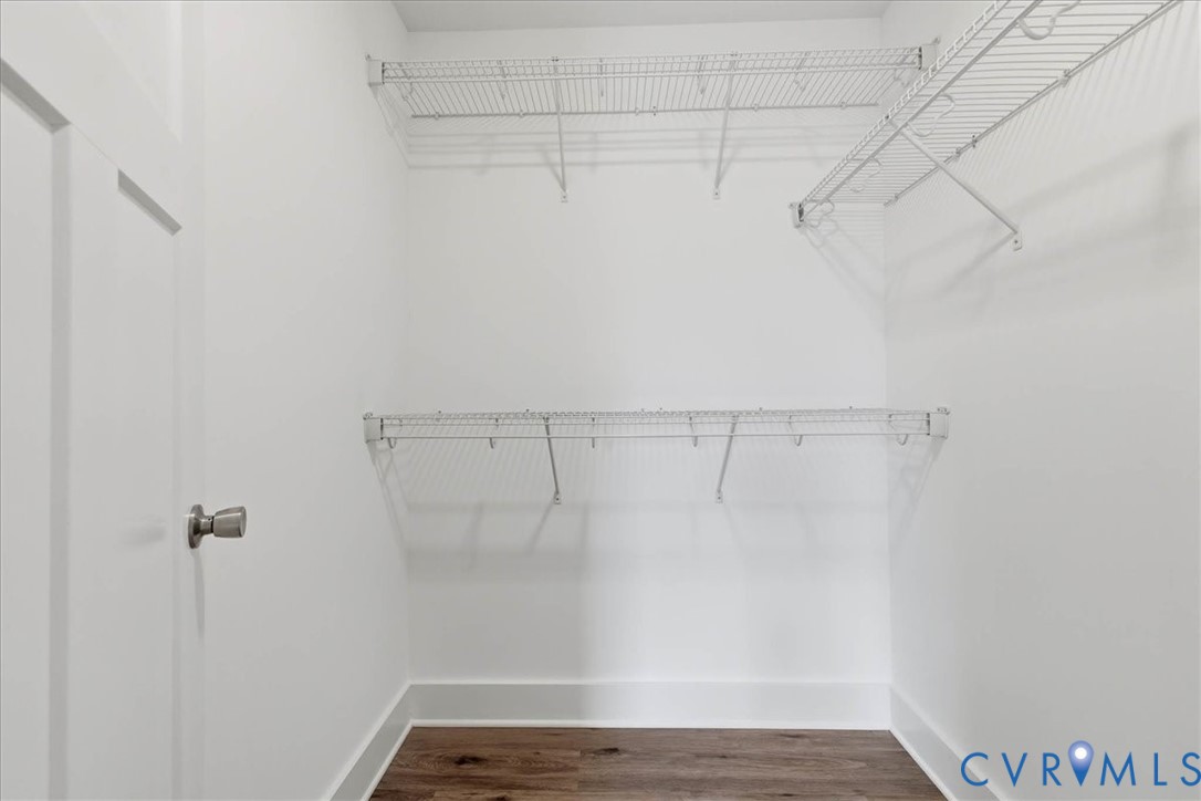 1588 Lansing Road Petersburg, VA 23805 - Photo 18 of 25 Walk in closet with dark wood-type flooring