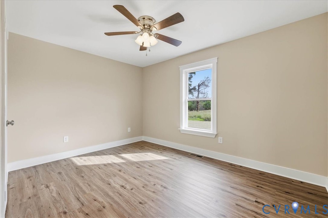 1588 Lansing Road Petersburg, VA 23805 - Photo 22 of 25 Spare room with light wood-style flooring and a ce
