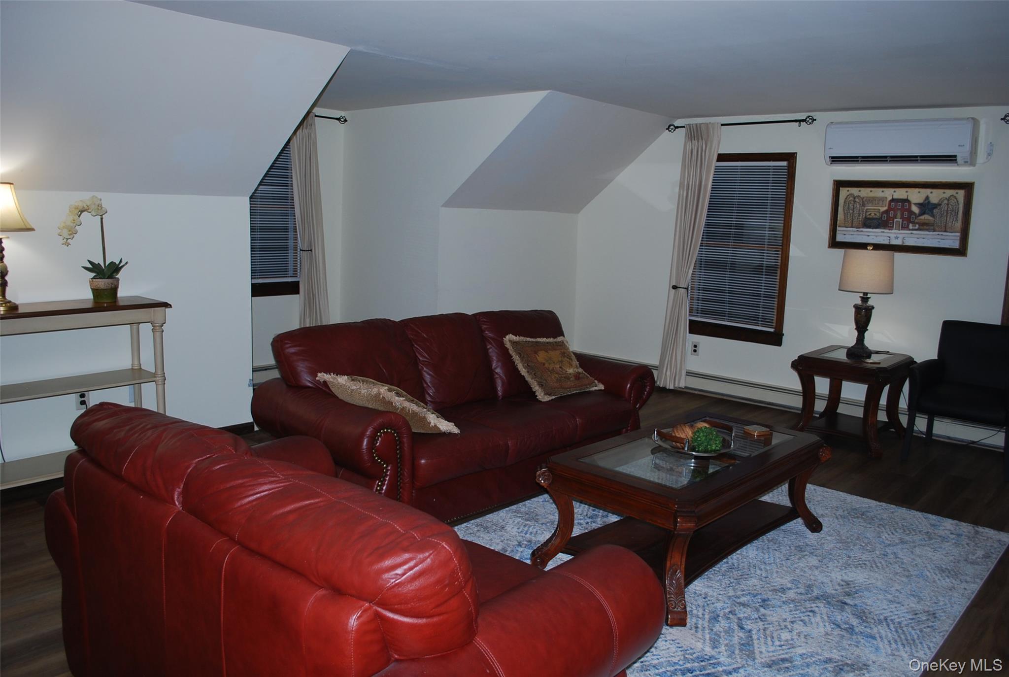 25 Hathorn Road, Unit 2 Warwick, NY 10990 - Photo 3 of 10 a living room with furniture a rug and a lamp