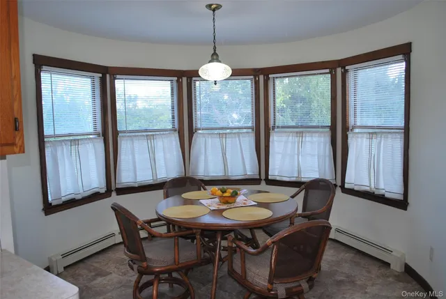 a view of a dining room with furniture window and outside view