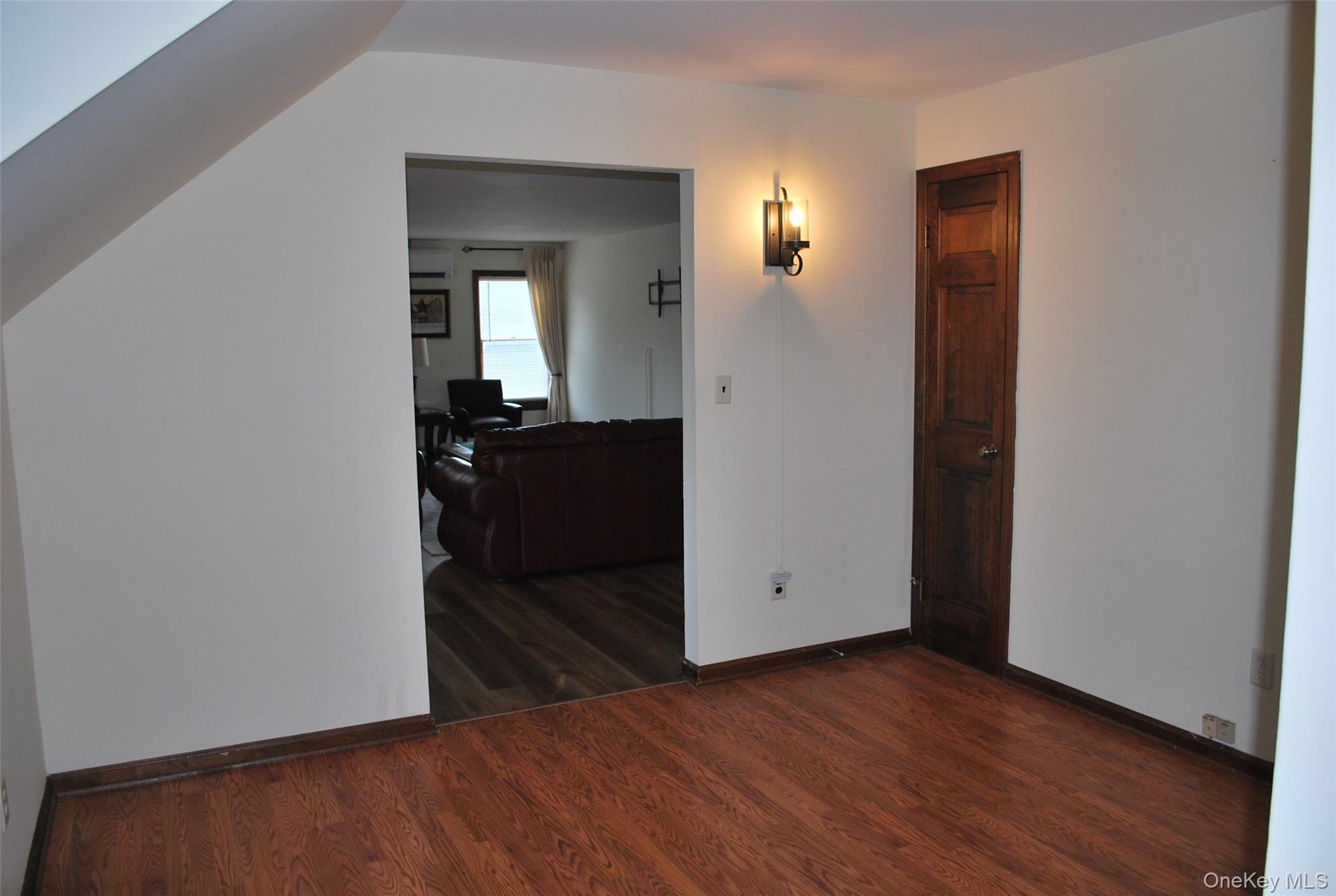 25 Hathorn Road, Unit 2 Warwick, NY 10990 - Photo 8 of 10 an empty room with wooden floor and closet