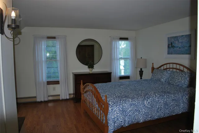 a bedroom with a bed and a fireplace