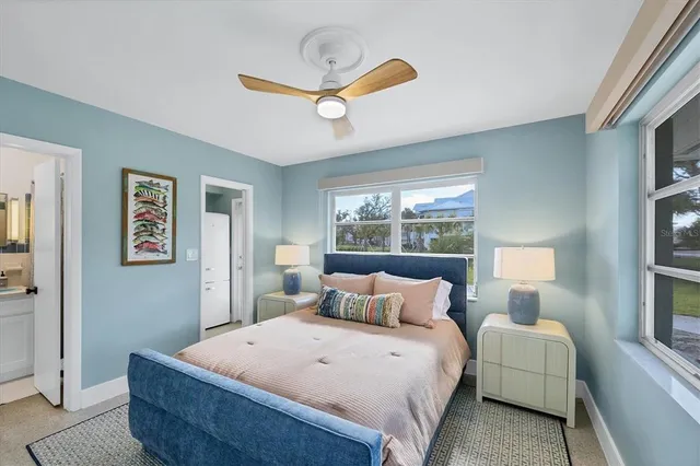 a bedroom with bed and window